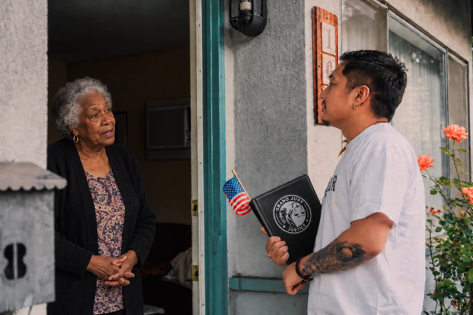 Illustrative scene of a volunteer holding a Grand Jury Justice folder while speaking with a resident at her doorway